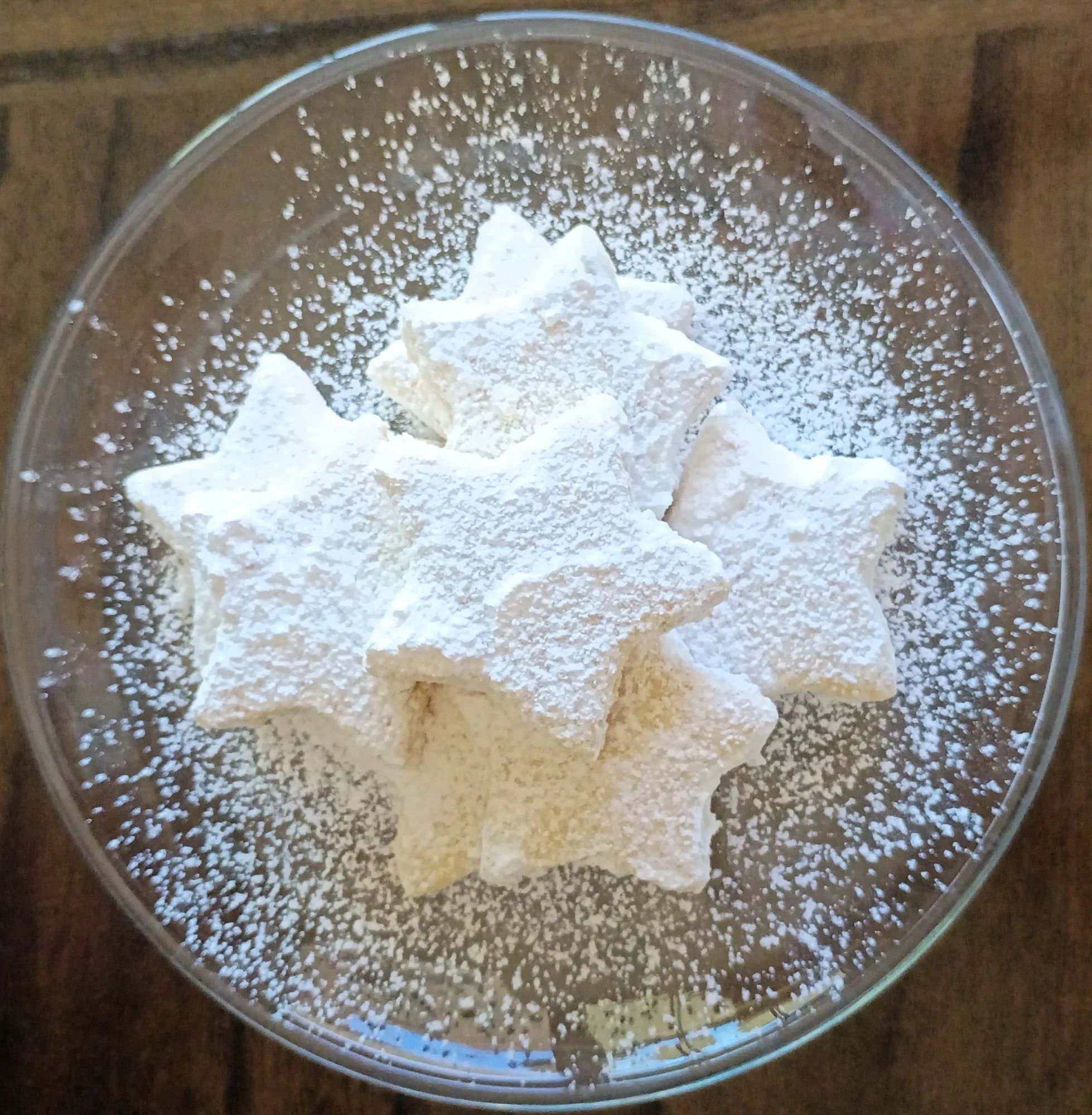 These star-shaped cookies are filled with coconut and rolled in powdered sugar