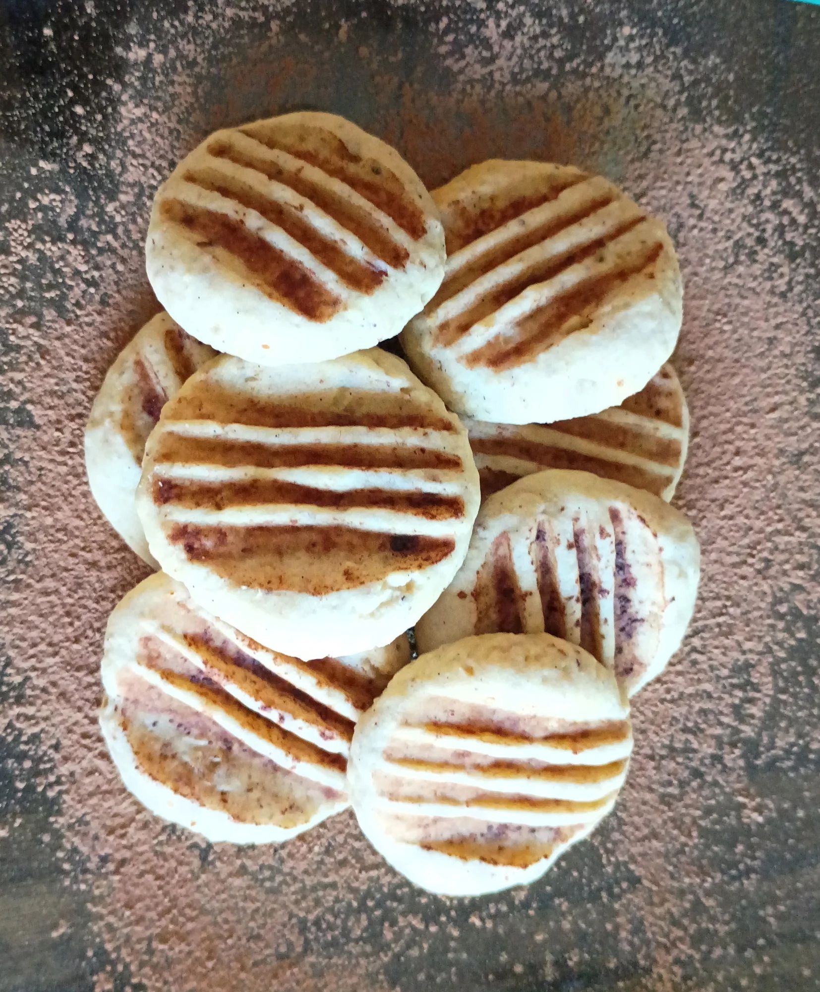 The hazelnutty dough is kneaded into balls, shaped, and decorated with cocoa powder for a simple look, but powerful taste.